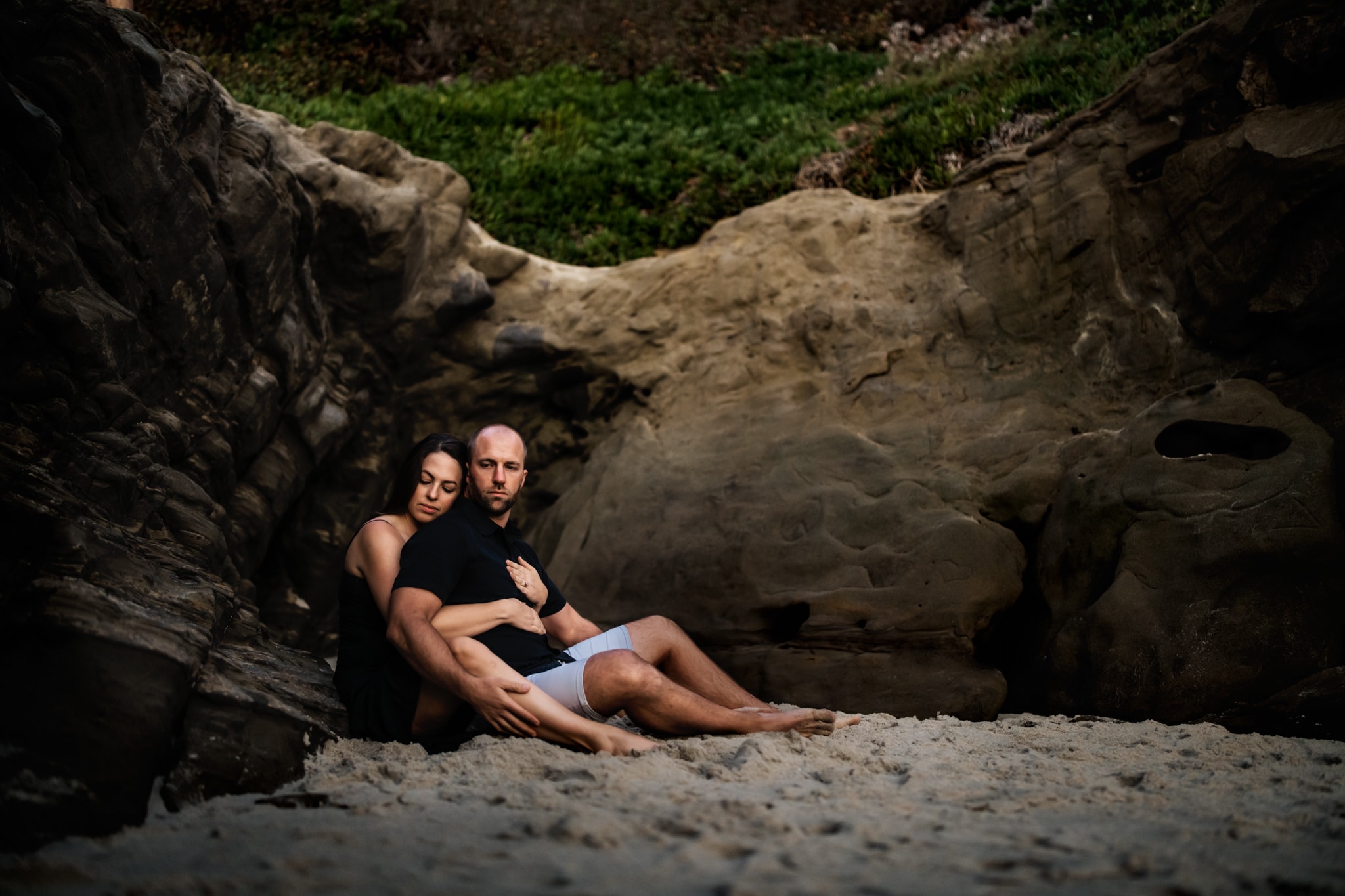 Husband and Wife sitting together on Windansea Beach