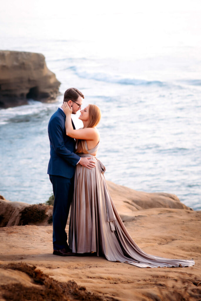 Couple holding each other at Sunset Cliffs, San Diego